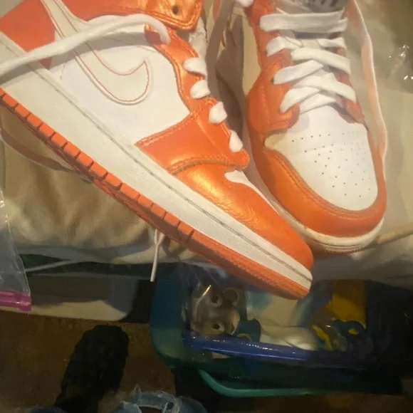 Nike mid 1 orange and white air Jordan.